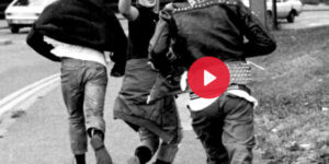 Youths running away, black and white image